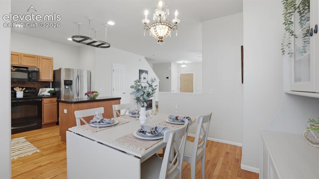 Image 12 of 29: The walk out Dining Room is located off the Kitchen for easy food service a