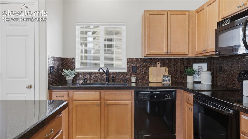 Image 13 of 29: Convenient Powder Bathroom with pedestal sink.
