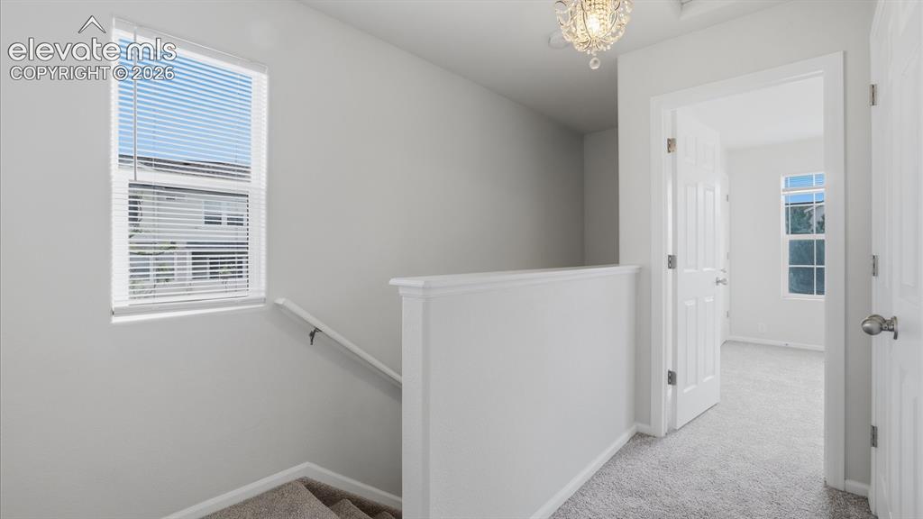 Image 16 of 29: Stylish appliances include a smooth top range oven, microwave, dishwasher, 