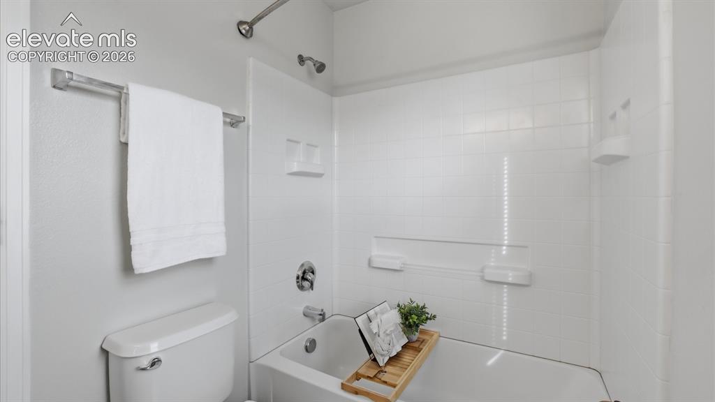 Image 21 of 29: View into the adjoining Bathroom from the Primary Bedroom.