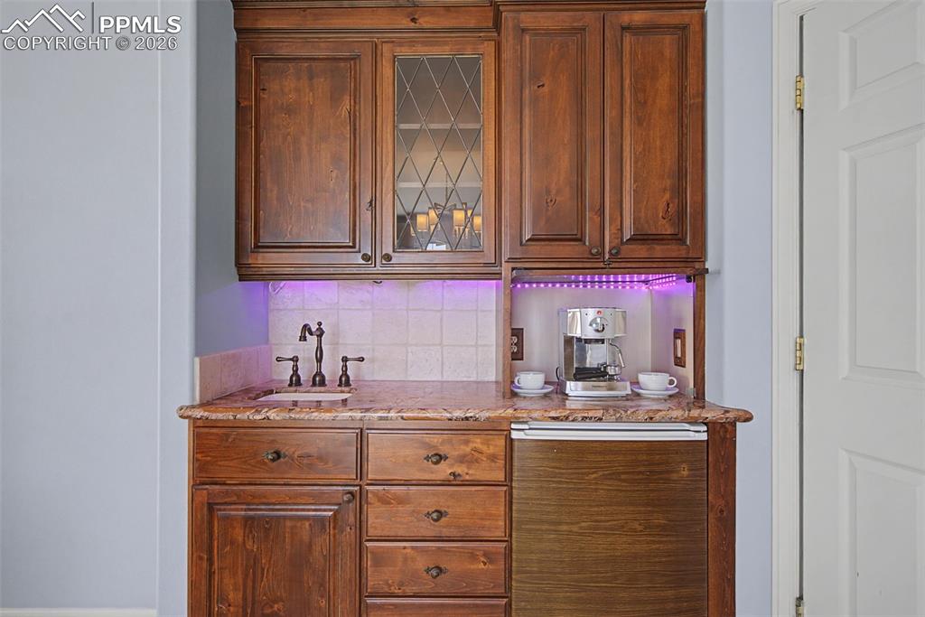 Image 26 of 50: Primary Bedroom Wet Bar