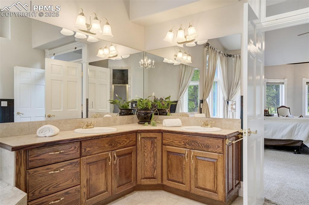 Image 26 of 50: Ensuite bathroom with double vanity