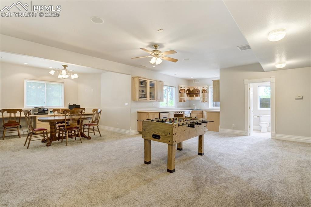 Image 33 of 50: Family room is generously sized to accommodate entertaining, games, work ar