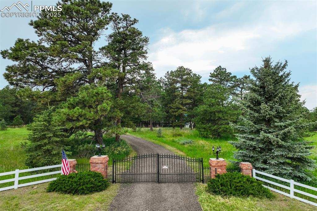 Image 46 of 50: Beautifully fenced and gated property