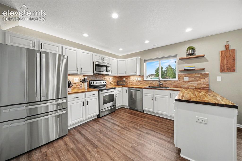 Image 12 of 34: Over and under cabinet lights