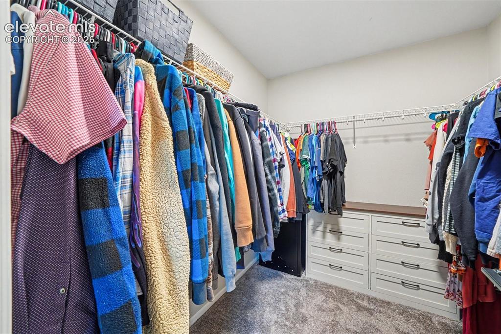 Image 22 of 34: Walk in closet in primary suite