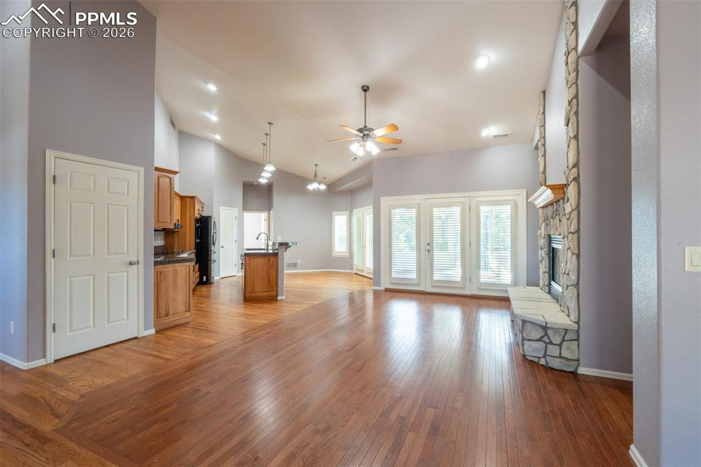 Image 2 of 49: Living room, Gas Fireplace, 14 ft high ceilings, hardwood floors, walk out 