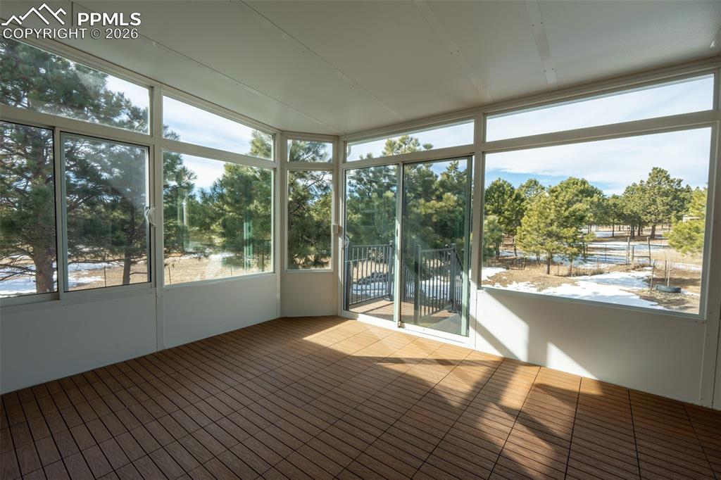 Image 25 of 49: Champion Windows Enclosed Sunroom with electricity 