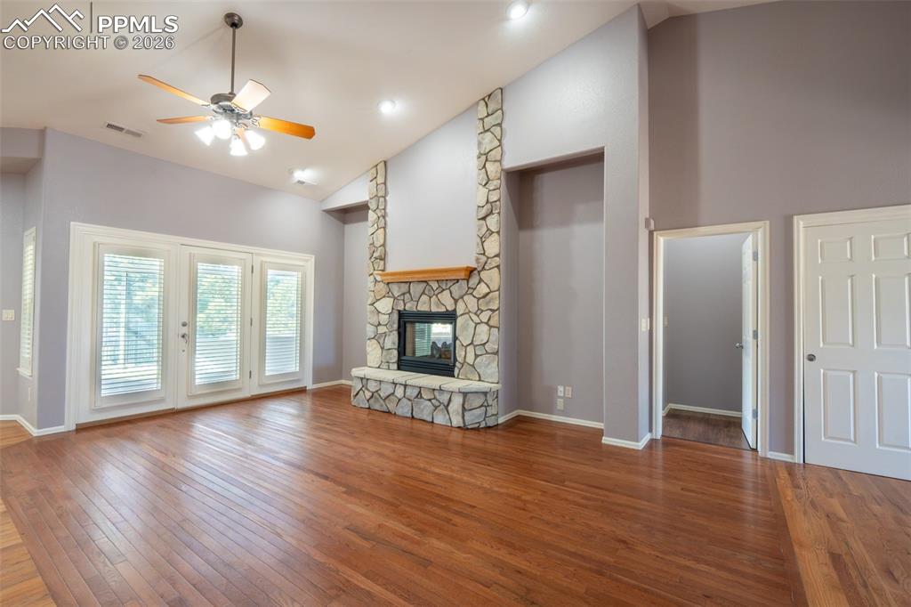Image 3 of 49: Living room, Gas Fireplace, 14 ft high ceilings, hardwood floors, walk out 