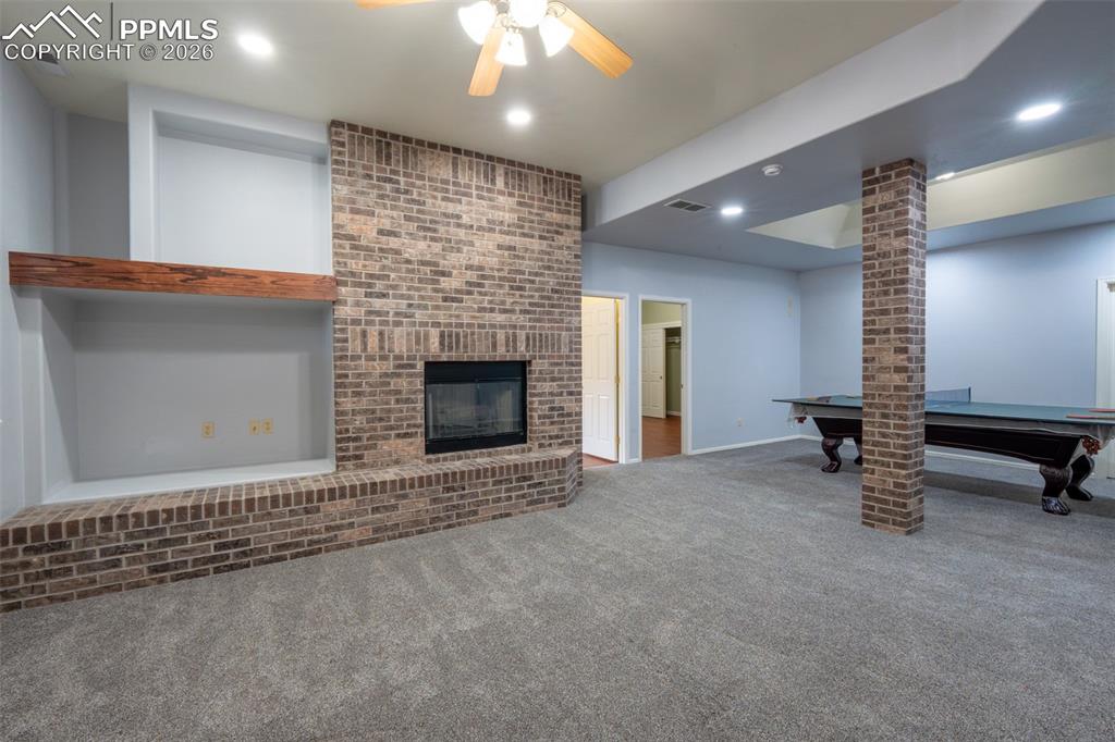 Image 35 of 49: Family Room 10 Ft ceilings, garden level, wood burning fireplace 