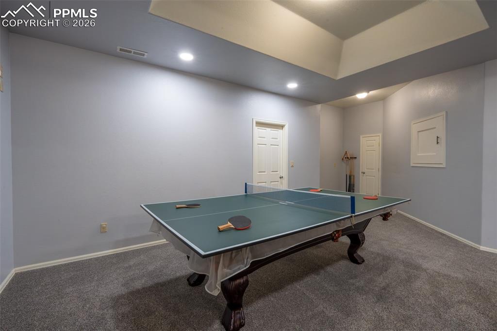 Image 37 of 49: Family Room 10 Ft ceilings, garden level, pool table/ping pong table