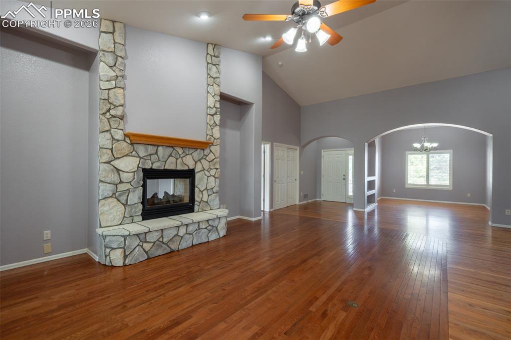 Image 4 of 49: Living room, Gas Fireplace, 14 ft high ceilings, hardwood floors 