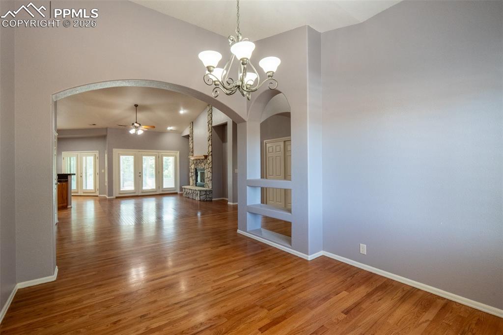 Image 6 of 49: Dining Room, wood floors, Plantation Shutters