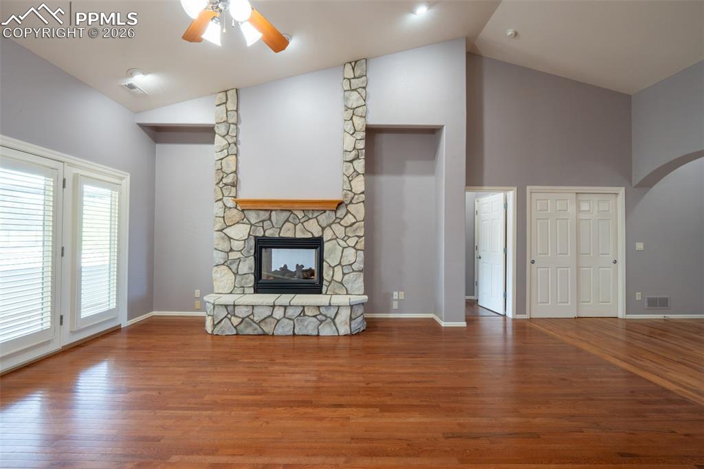 Image 7 of 49: Living room, Gas Fireplace, 14 ft high ceilings, hardwood floors 