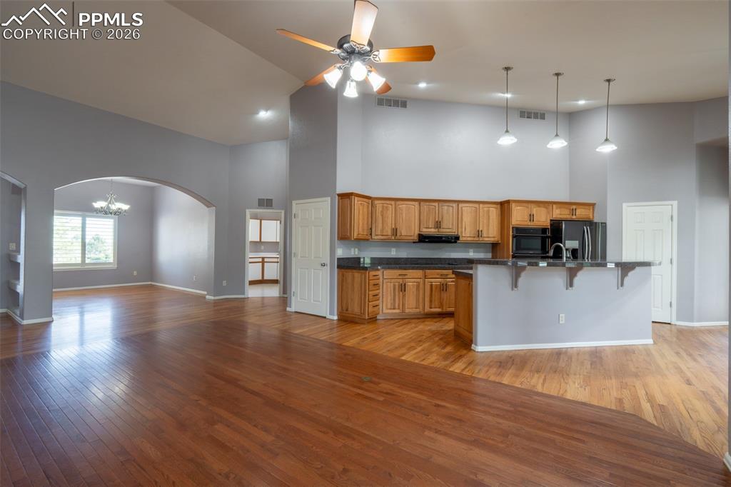Image 8 of 49: Black Stainless Steel Appliances, Granite Tile Countertops, 14 ft high ceil