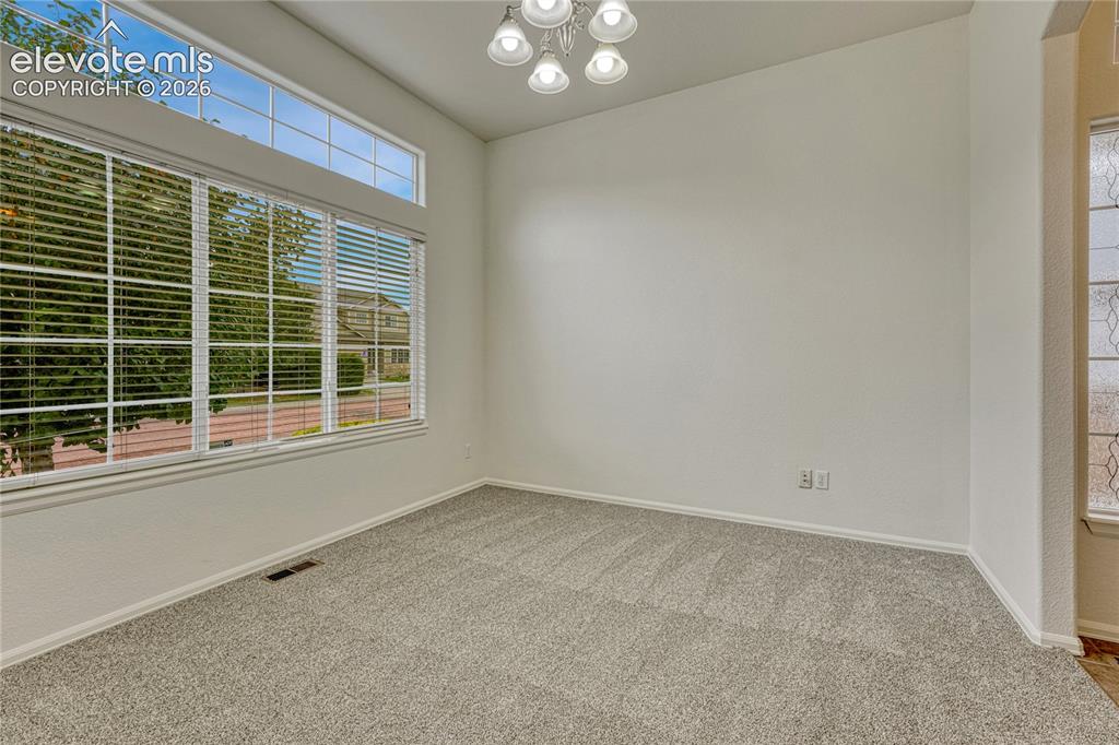 Image 11 of 36: Main level office with new carpet and paint...