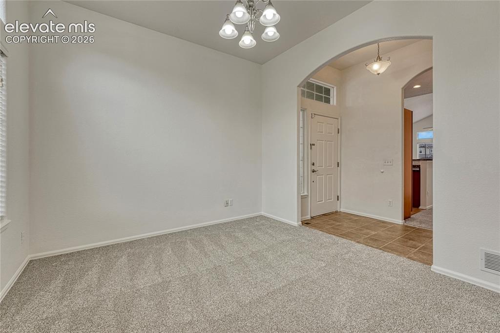 Image 12 of 36: ...adjacent to the front entrance. Notice the arched entry.