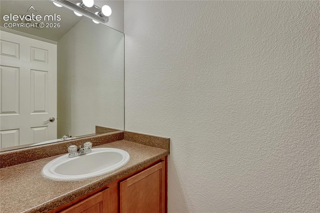 Image 19 of 36: Main level powder room.