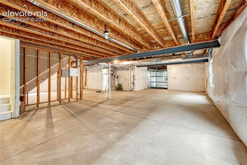 Image 28 of 36: Large unfinished basement.