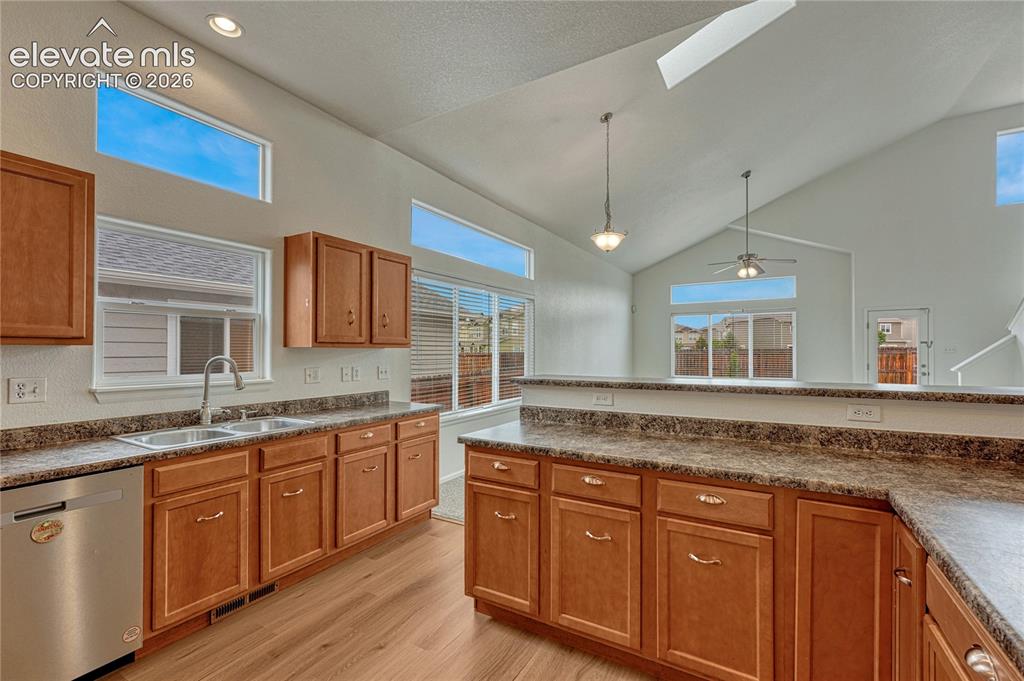 Image 8 of 36: ...and ample counter space with the L-shaped island.
