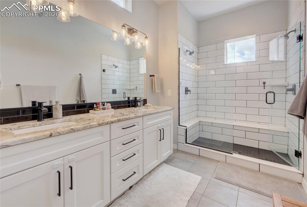Image 17 of 42: This photo showcases the master bathroom, featuring a custom-designed walk-