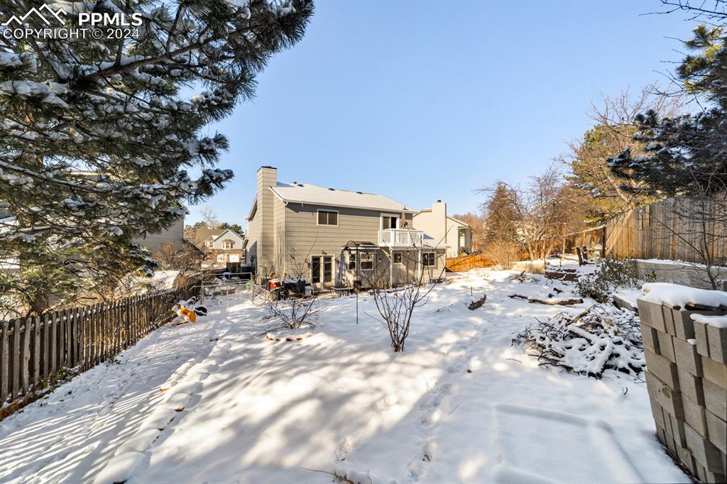 Image 40 of 50: View of snow covered house