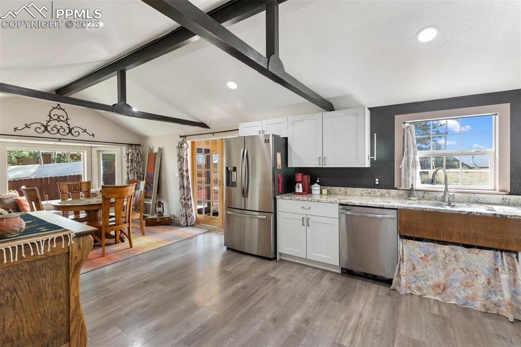 Image 14 of 44: Cabinet doors for sink cabinet are on site.