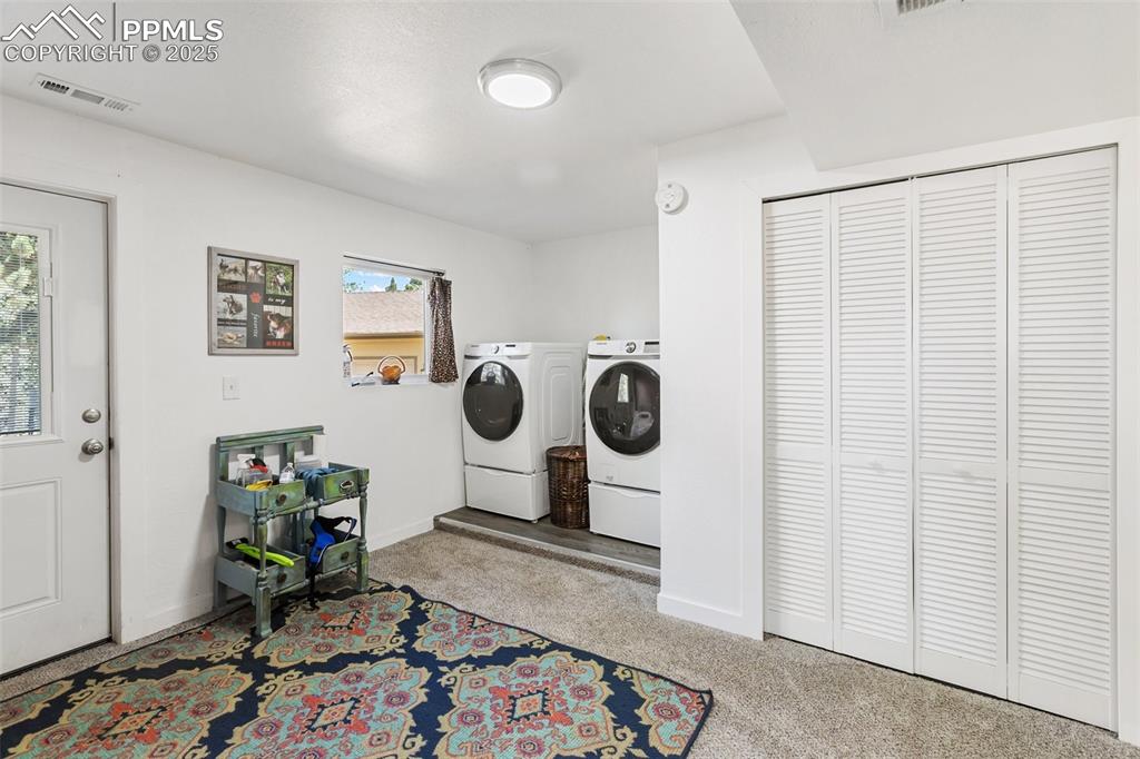 Image 37 of 44: Entry from driveway on side of home.