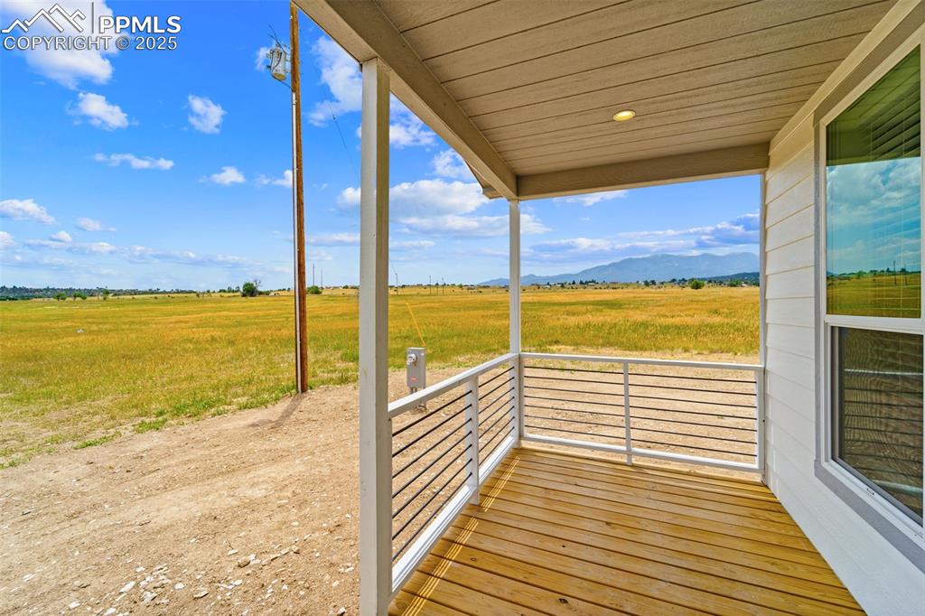 Image 7 of 44: Wooden terrace featuring a view of rural / pastoral area