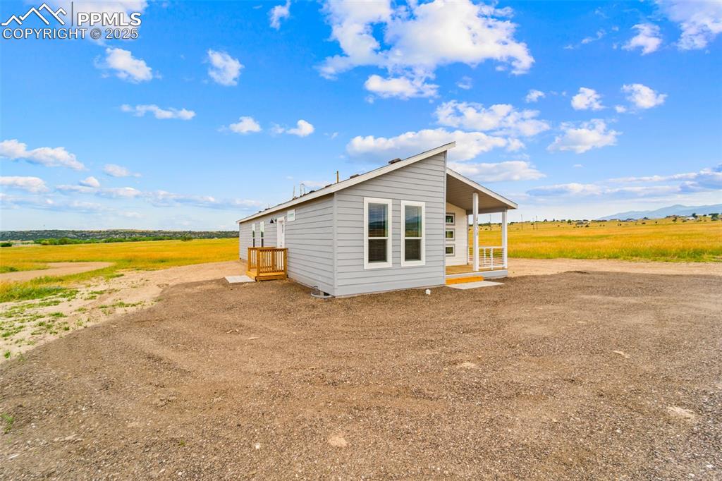Image 9 of 44: View of front of house with a view of countryside