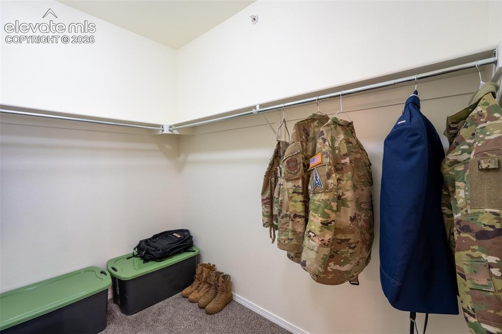 Image 15 of 26: Primary walk in closet