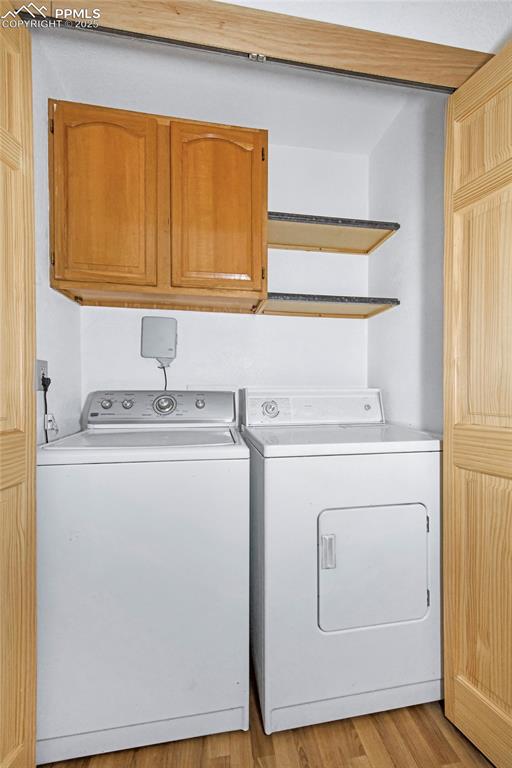Image 7 of 19: With built-in cabinets and washer and dryer