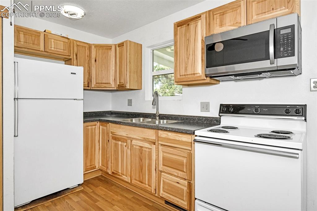 Image 8 of 19: Refrigerator, range/oven, microwave