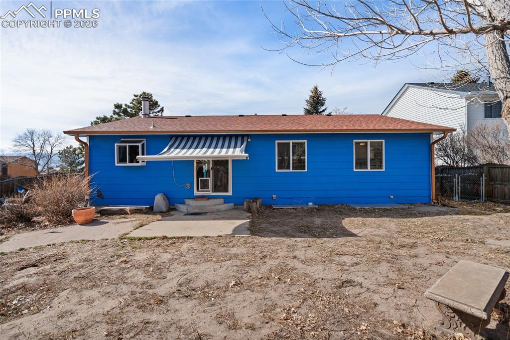 Image 23 of 27: Large concrete patio for enjoying the Colorado sunshine.