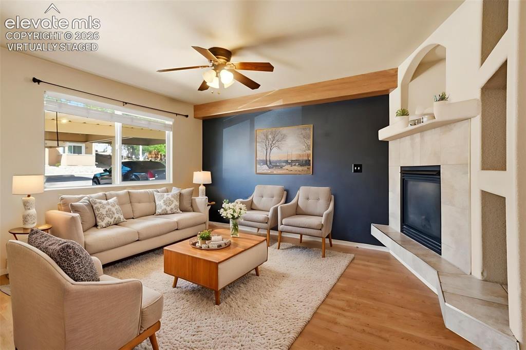 Image 3 of 48: Virtually Staged - Spacious Living Room with Gas Fireplace