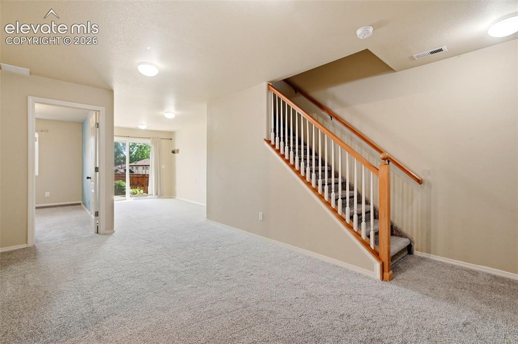 Image 33 of 48: Down to the Walk-out Basement