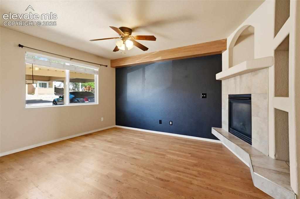 Image 4 of 48: Spacious Living Room with Gas Fireplace