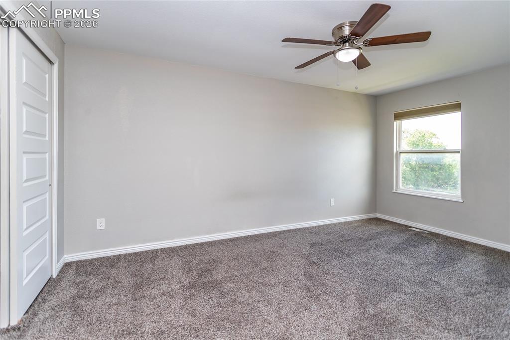 Image 18 of 32: Primary Bedroom with walk-in closet