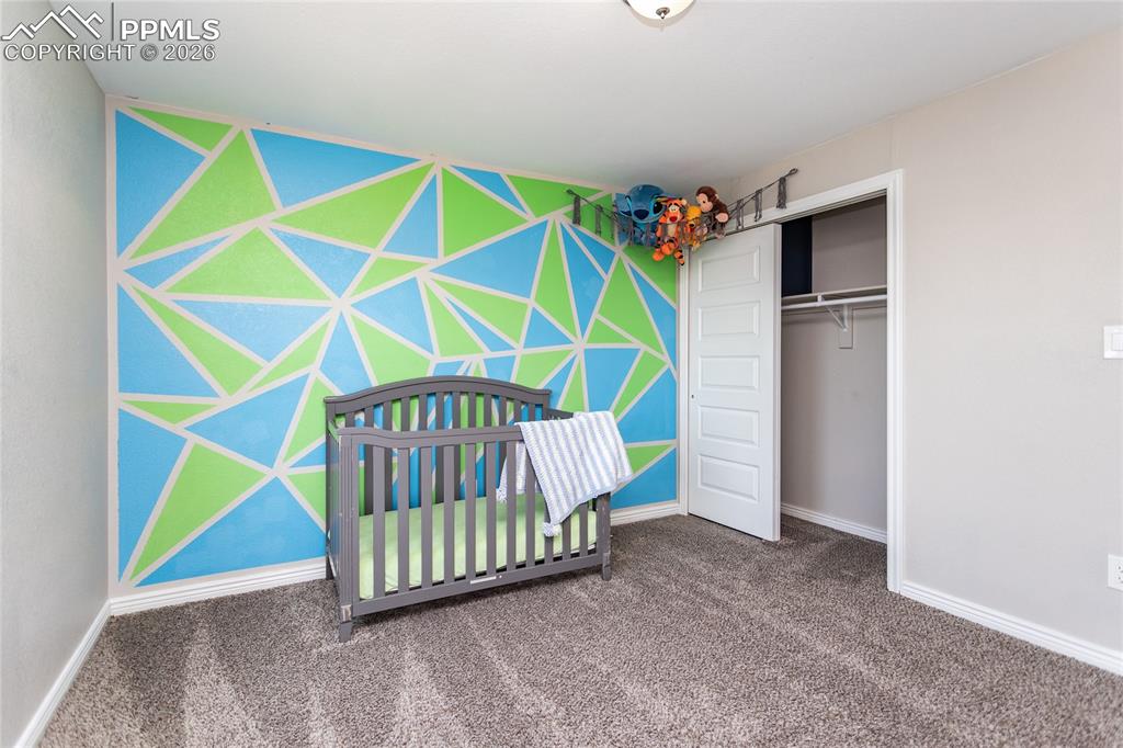 Image 20 of 32: Second bedroom located on upper level with Primary bedroom