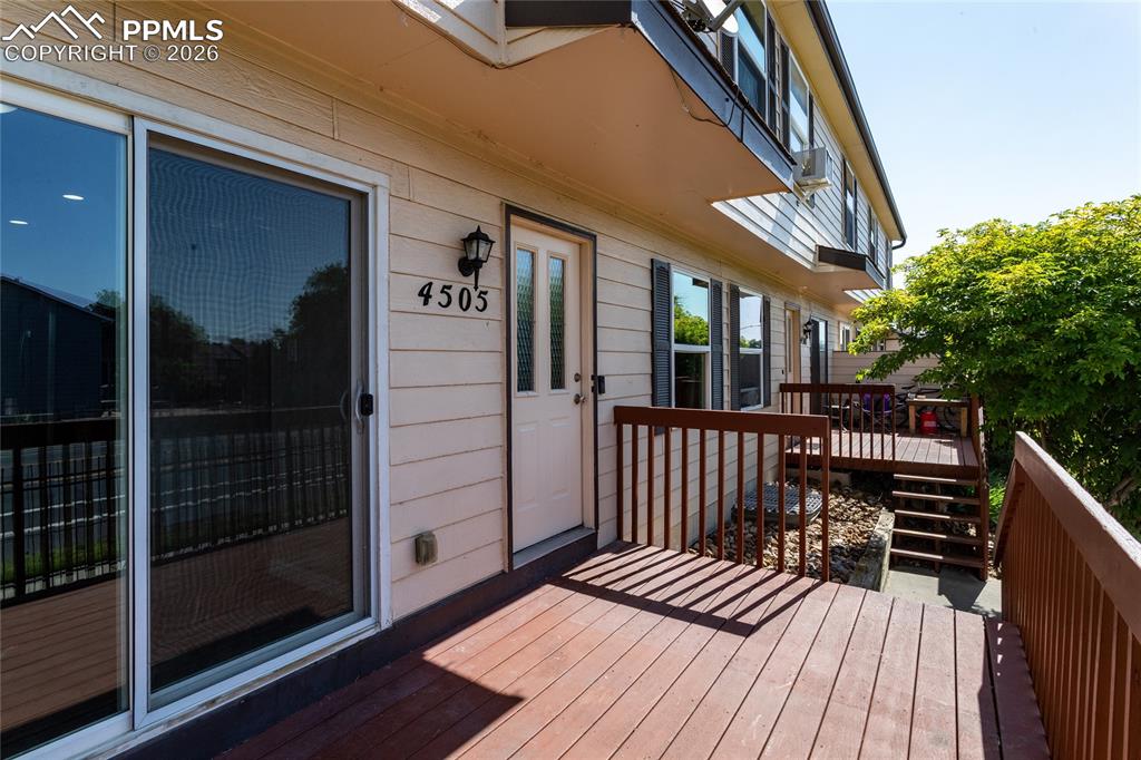 Image 4 of 32: Enjoy the sunny deck accessible from either the dining area or living room.