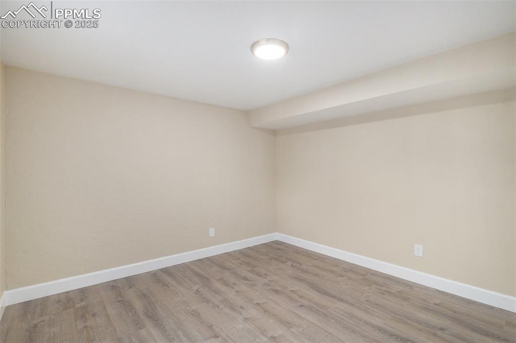 Image 15 of 26: GARDEN LEVEL Fourth Bedroom with New LVP Flooring!