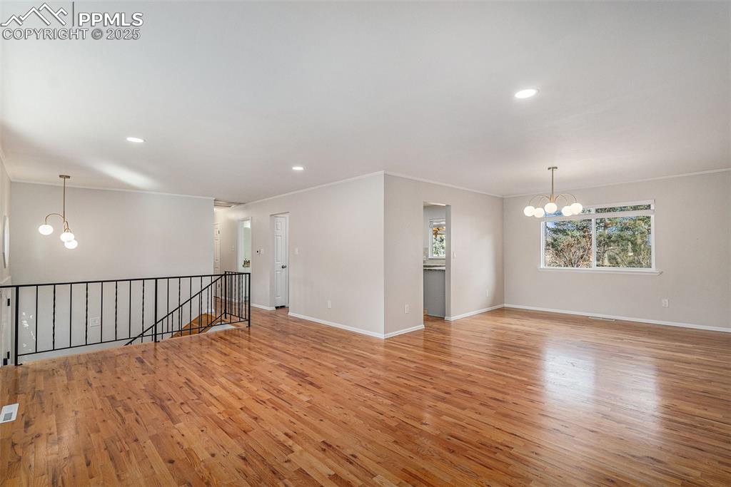 Image 6 of 26: Extended Living Room and Private Dining Area with Views to the Gorgeous Bac