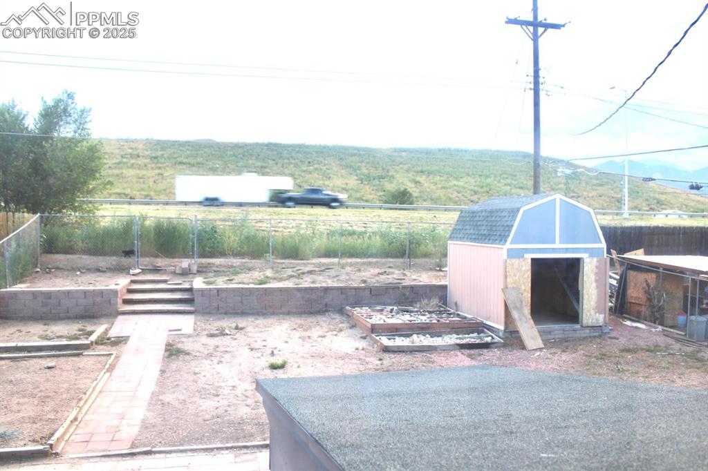 Image 15 of 15: View of yard featuring a storage shed