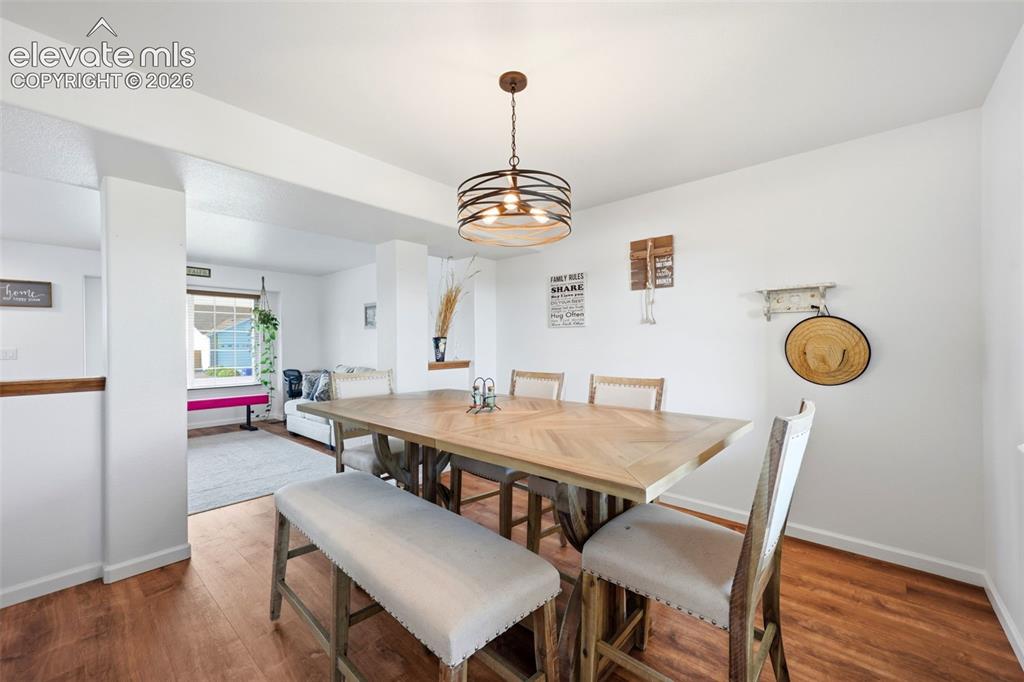Image 5 of 40: Wood-finish flooring throughout