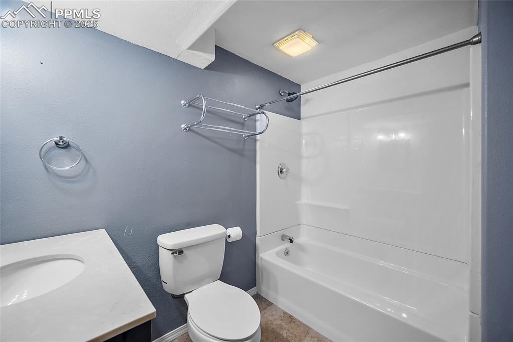 Image 44 of 50: Bathroom featuring shower / washtub combination and vanity