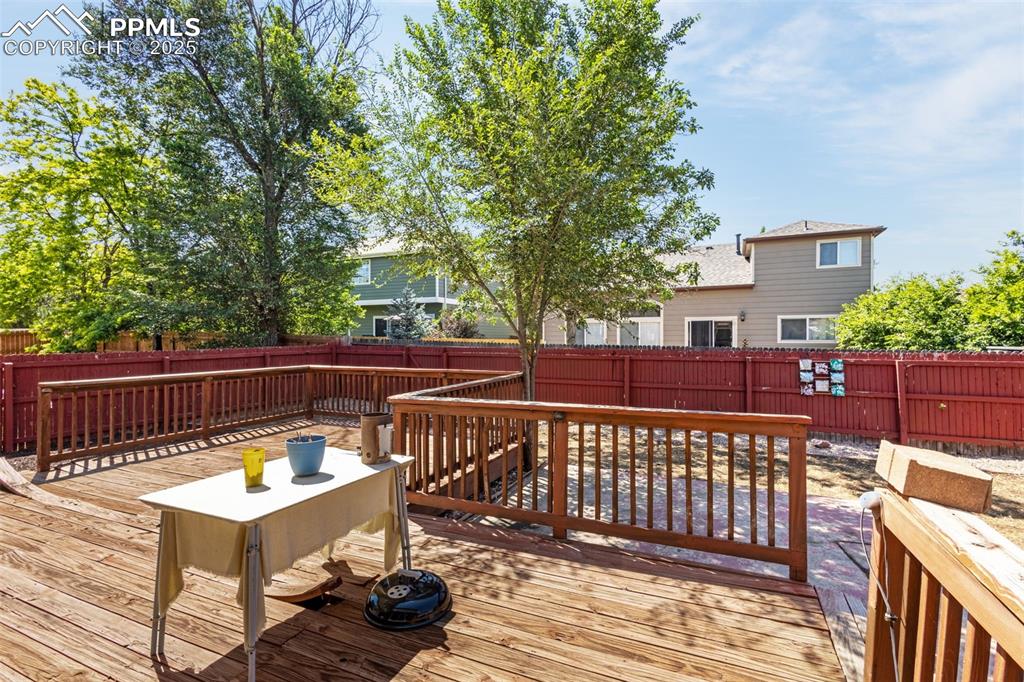 Image 29 of 33: Deck with a fenced backyard