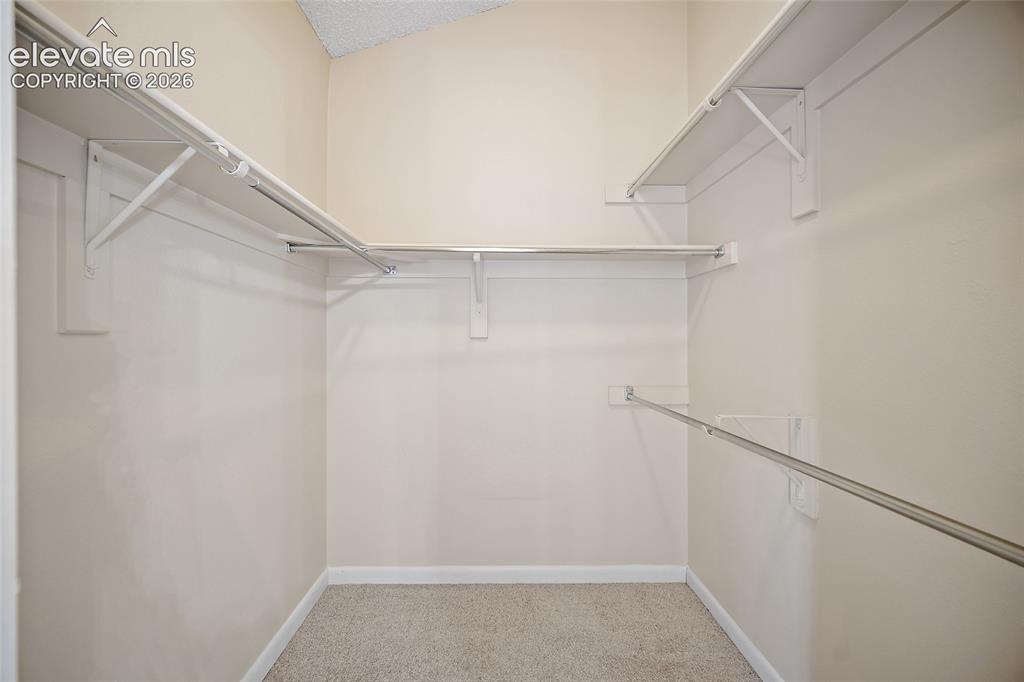 Image 20 of 42: Primary walk-in closet