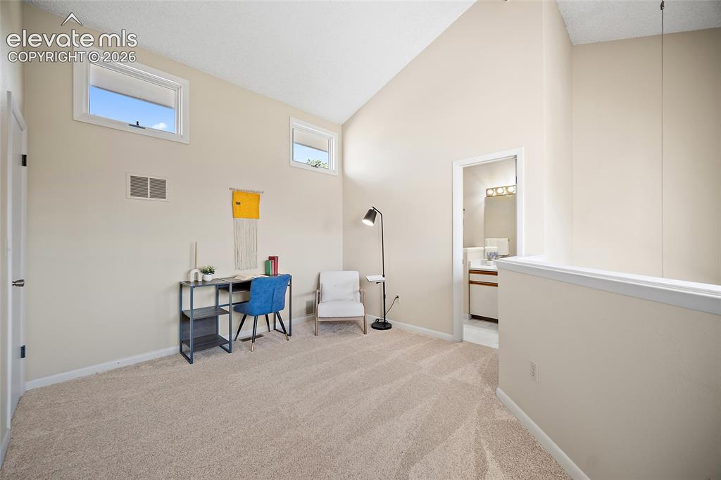 Image 26 of 42: Upstairs loft bedroom or office