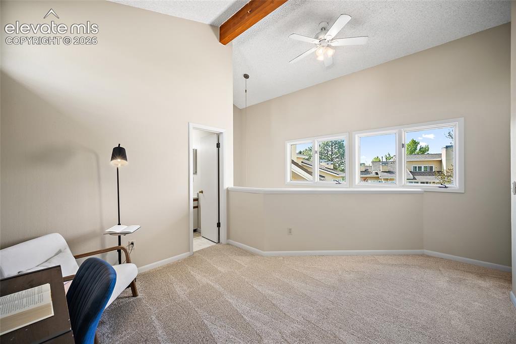 Image 27 of 42: Loft bedroom with vaulted open ceiling