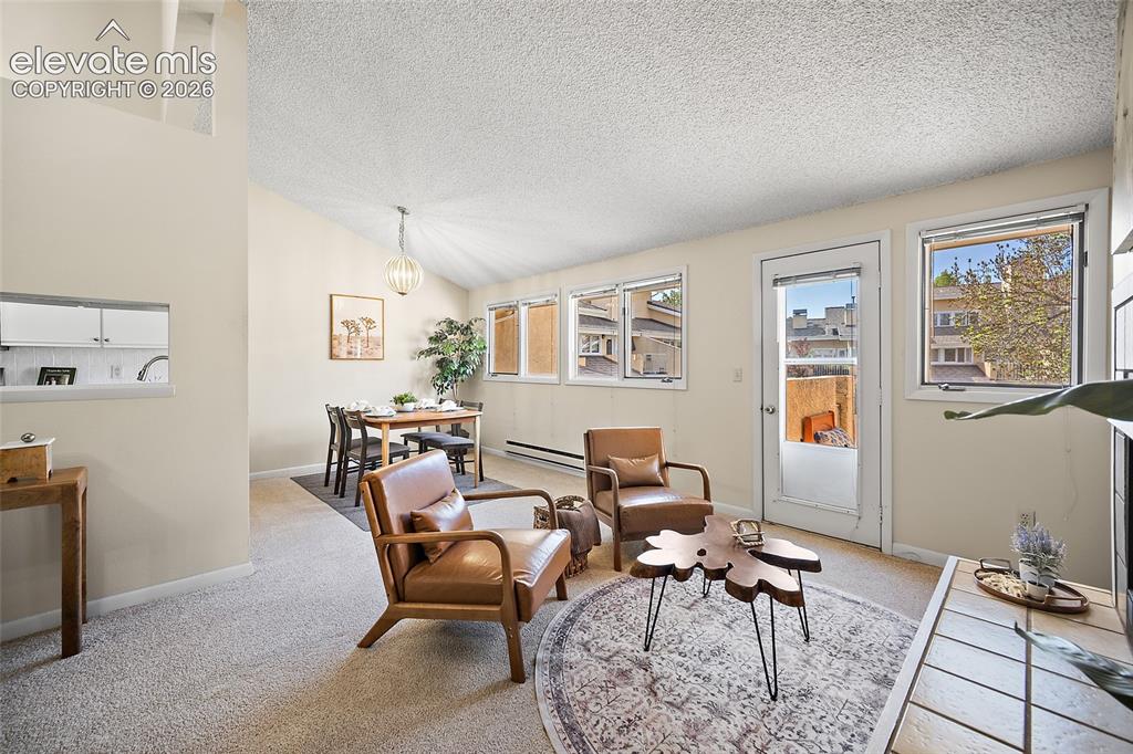 Image 6 of 42: Living room with view to dining room